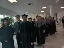 doktoranci z promotorami i Rada Wydziału